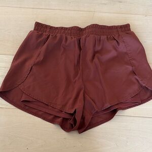 Girlfriend Collective Athletic Shorts in Rust
